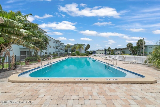 221 Columbia Dr Unit 139, Cape Canaveral, FL 32920 - community pool featuring a residential view and a patio area