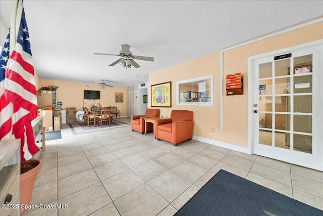 221 Columbia Dr Unit 139, Cape Canaveral, FL 32920 - sitting room featuring ceiling fan, tile patterned flooring, and baseboards