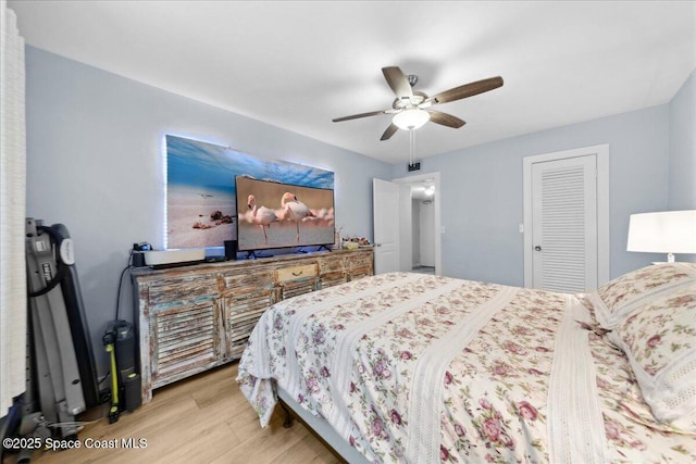 221 Columbia Dr Unit 139, Cape Canaveral, FL 32920 - bedroom with wood finished floors, a ceiling fan, and a closet