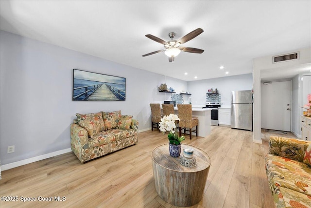 221 Columbia Dr Unit 139, Cape Canaveral, FL 32920 - living room featuring light wood finished floors, a ceiling fan, recessed lighting, and baseboards