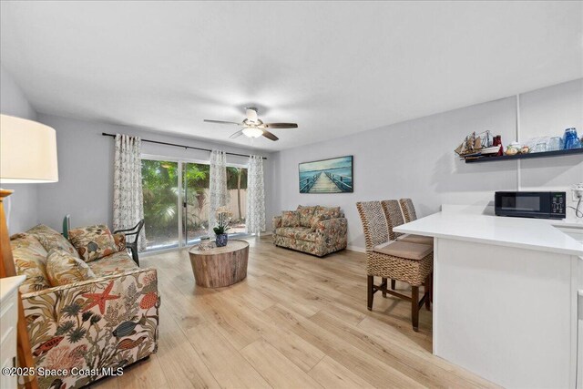 221 Columbia Dr Unit 139, Cape Canaveral, FL 32920 - living room with light wood-style flooring and a ceiling fan