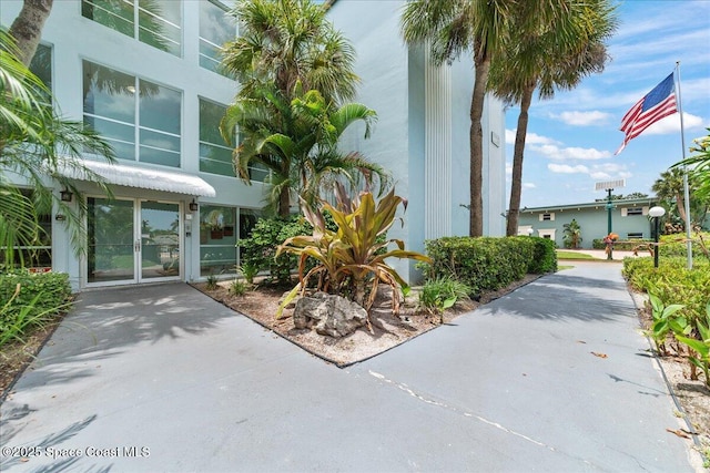 221 Columbia Dr Unit 139, Cape Canaveral, FL 32920 - property entrance featuring stucco siding