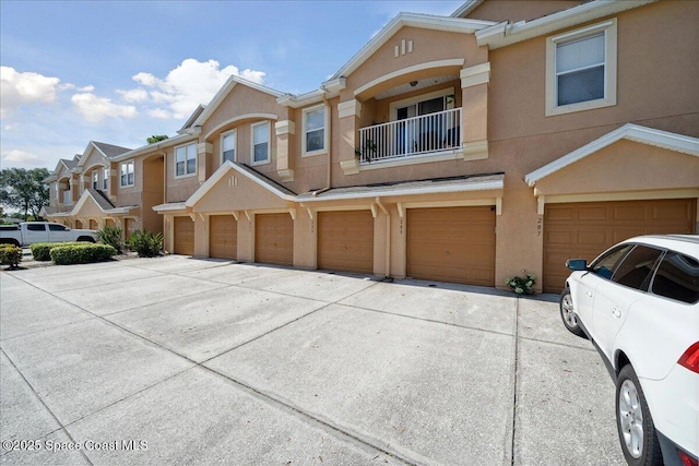 4047 Meander Pl Unit 208, Rockledge, FL 32955 - townhome / multi-family property with driveway, stucco siding, and an attached garage