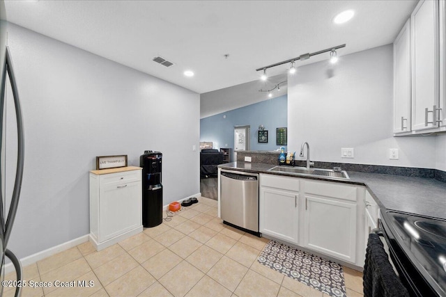 4047 Meander Pl Unit 208, Rockledge, FL 32955 - kitchen featuring stainless steel appliances, white cabinetry, dark countertops, light tile patterned floors, and recessed lighting