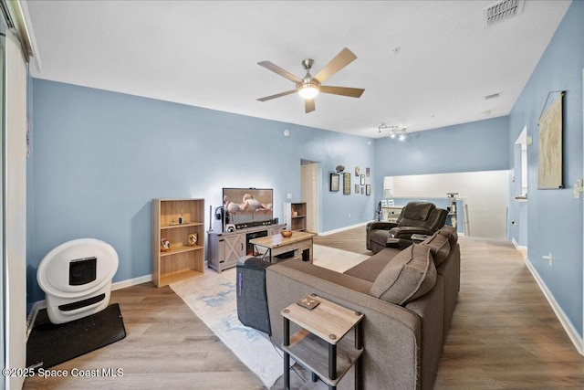 4047 Meander Pl Unit 208, Rockledge, FL 32955 - living room with wood finished floors and a ceiling fan