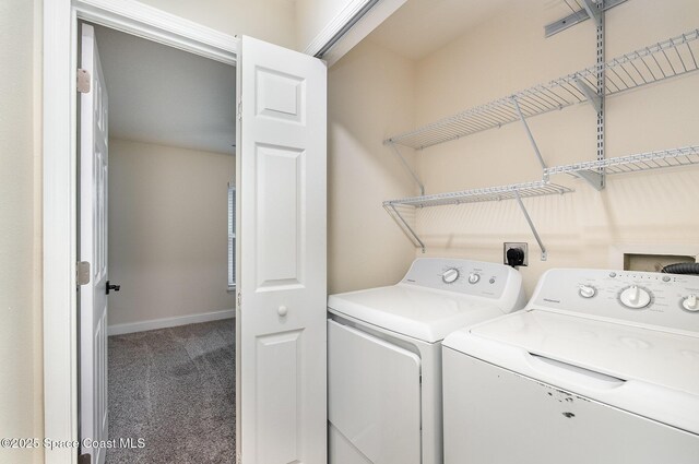 2111 Spring Creek Cir, Palm Bay, FL 32905 - laundry area with carpet, washer and clothes dryer, and baseboards