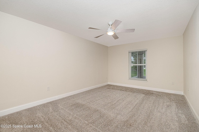 2111 Spring Creek Cir, Palm Bay, FL 32905 - carpeted spare room featuring baseboards, a ceiling fan, and a textured ceiling