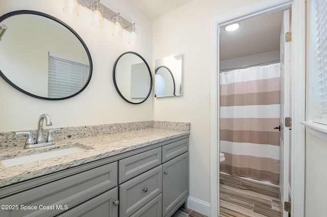 2111 Spring Creek Cir, Palm Bay, FL 32905 - full bath featuring vanity, toilet, wood finished floors, and a shower with curtain