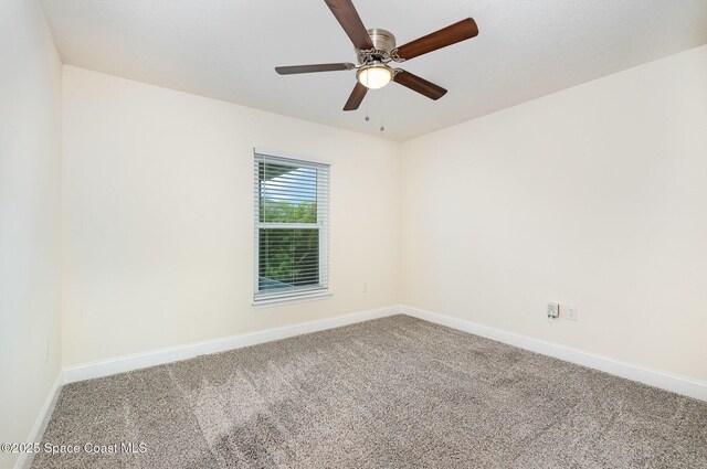 2111 Spring Creek Cir, Palm Bay, FL 32905 - carpeted spare room featuring baseboards and a ceiling fan