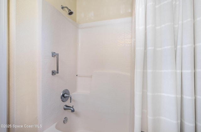2111 Spring Creek Cir, Palm Bay, FL 32905 - bathroom featuring shower / bathtub combination with curtain