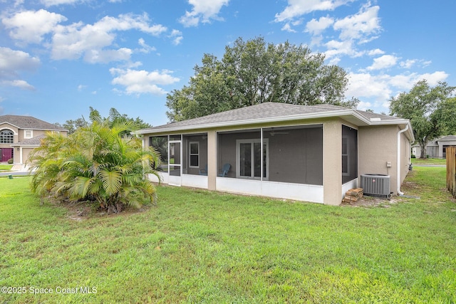 2111 Spring Creek Cir, Palm Bay, FL 32905 - back of property with a sunroom and a yard