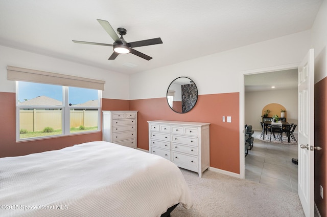 4791 Talbot Blvd, Cocoa, FL 32926 - bedroom featuring light carpet, light tile patterned floors, and a ceiling fan