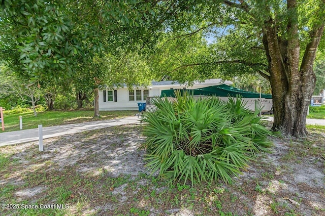 501 Santo Domingo Ave SW, Palm Bay, FL 32908 - view of property hidden behind natural elements with driveway