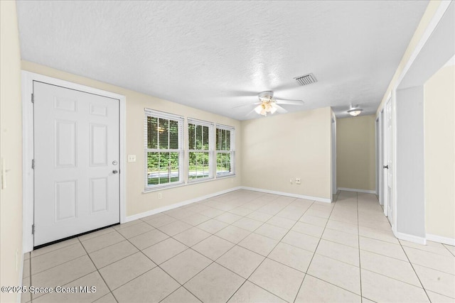 501 Santo Domingo Ave SW, Palm Bay, FL 32908 - entryway with a ceiling fan, light tile patterned flooring, and a textured ceiling