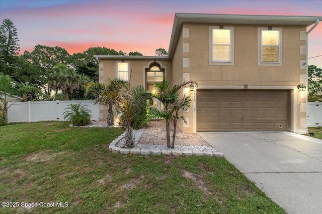 6735 Grissom Pkwy, Cocoa, FL 32927 - view of front of house featuring stucco siding, concrete driveway, and an attached garage