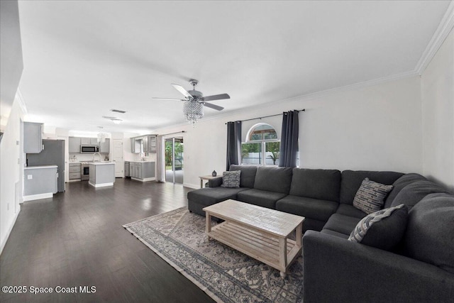 6735 Grissom Pkwy, Cocoa, FL 32927 - living area featuring ornamental molding, ceiling fan, dark wood-style flooring, and baseboards