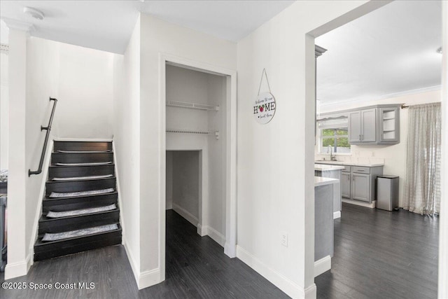 6735 Grissom Pkwy, Cocoa, FL 32927 - stairs featuring wood finished floors and baseboards