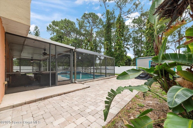 6735 Grissom Pkwy, Cocoa, FL 32927 - view of swimming pool with a ceiling fan, a patio area, and a lanai