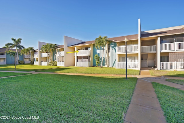250 N Banana River Dr Unit H-8, Merritt Island, FL 32952 - view of building exterior with a residential view