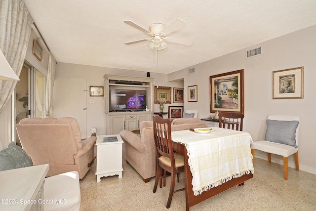 250 N Banana River Dr Unit H-8, Merritt Island, FL 32952 - dining area with dark speckled floor, a ceiling fan, and baseboards