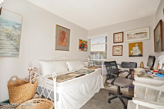 250 N Banana River Dr Unit H-8, Merritt Island, FL 32952 - carpeted bedroom featuring a desk