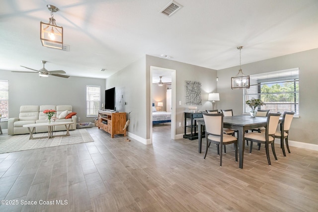 1237 Glenham Dr NE, Palm Bay, FL 32905 - dining room featuring ceiling fan, healthy amount of natural light, and light wood finished floors