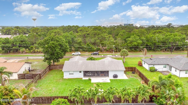 1237 Glenham Dr NE, Palm Bay, FL 32905 - aerial view of property and surrounding area featuring a heavily wooded area
