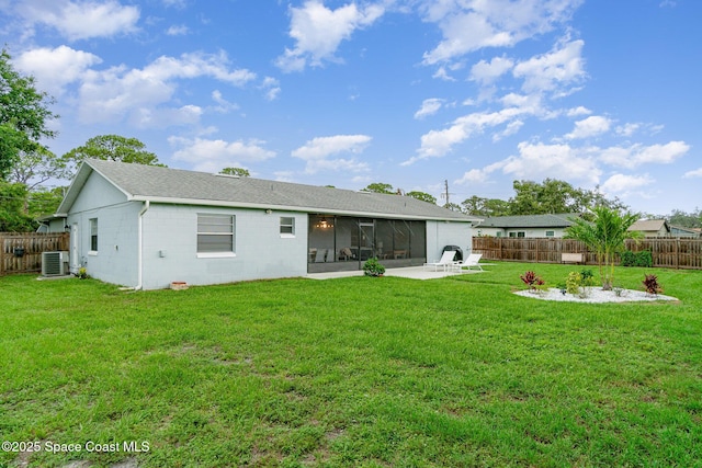1237 Glenham Dr NE, Palm Bay, FL 32905 - back of house featuring a sunroom, cooling unit, concrete block siding, a patio, and a shingled roof