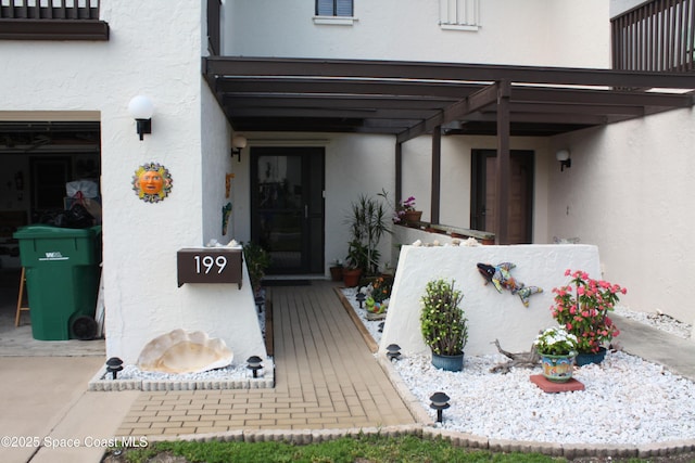 199 Skyline Ct, Satellite Beach, FL 32937 - property entrance featuring stucco siding