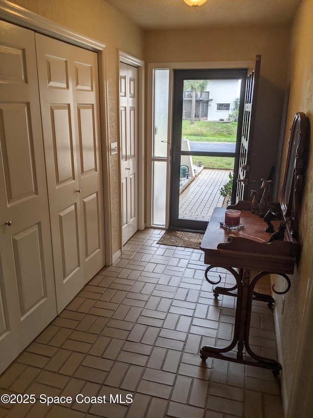 199 Skyline Ct, Satellite Beach, FL 32937 - entryway with brick patterned floors