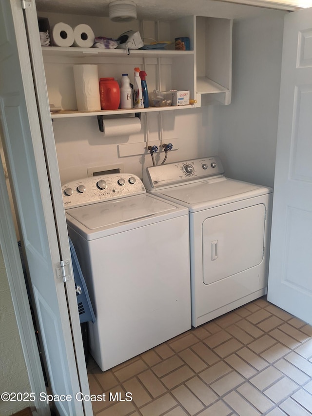 199 Skyline Ct, Satellite Beach, FL 32937 - laundry area with independent washer and dryer and brick patterned flooring