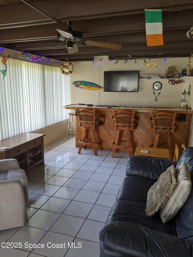 199 Skyline Ct, Satellite Beach, FL 32937 - living room with light tile patterned floors and ceiling fan