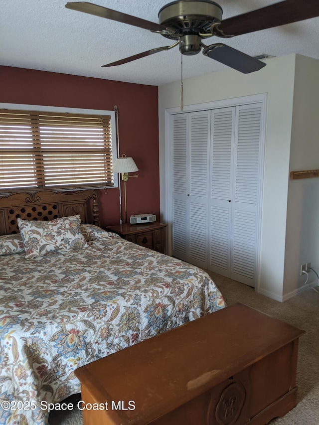 199 Skyline Ct, Satellite Beach, FL 32937 - carpeted bedroom featuring a closet, a ceiling fan, and a textured ceiling