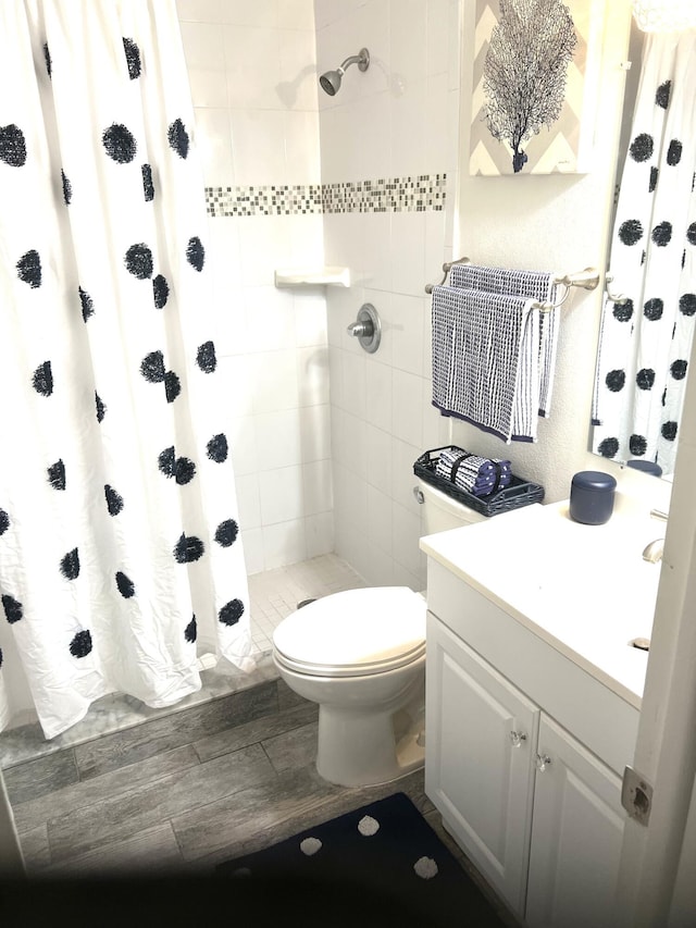 231 Bristol Ct Unit 231, Melbourne, FL 32935 - bathroom featuring toilet, vanity, and a stall shower