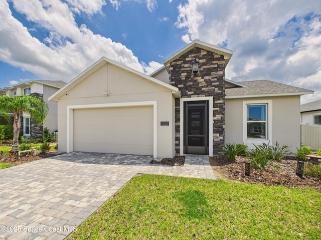 3466 Rixford Way, Palm Bay, FL 32909 - view of front facade featuring stucco siding, decorative driveway, an attached garage, and a front lawn