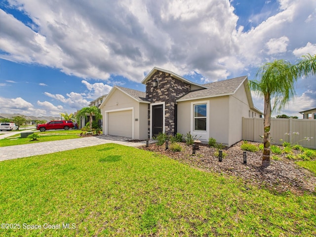 3466 Rixford Way, Palm Bay, FL 32909 - view of front of house with decorative driveway, a garage, and stucco siding