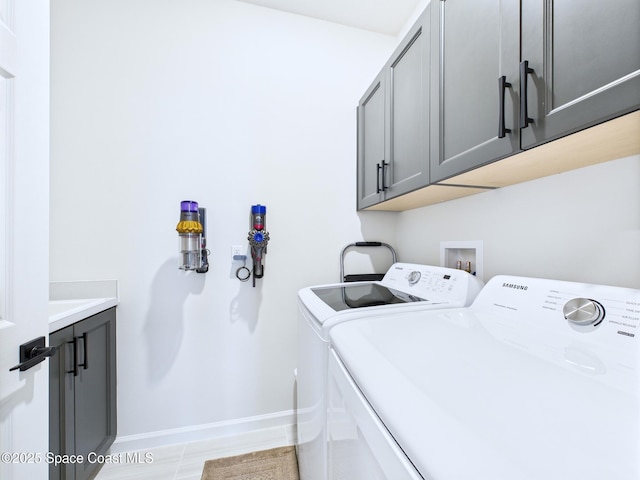 3466 Rixford Way, Palm Bay, FL 32909 - laundry area featuring washer and dryer, cabinet space, and baseboards