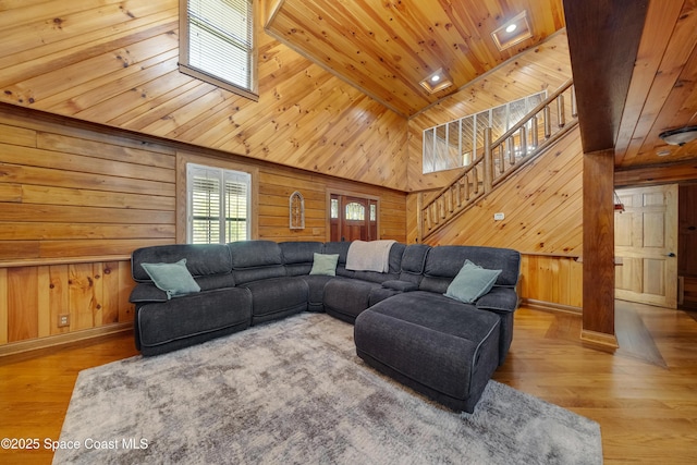 3373 Stratos Ln, Palm Bay, FL 32909 - living room with wood ceiling, wooden walls, stairs, high vaulted ceiling, and wood finished floors