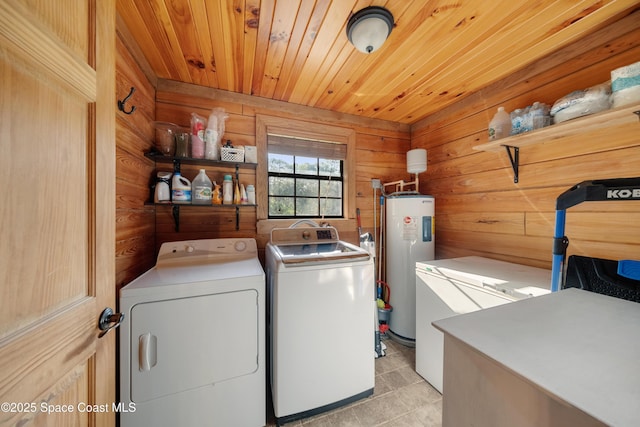 3373 Stratos Ln, Palm Bay, FL 32909 - washroom featuring washer and dryer, water heater, wood walls, wooden ceiling, and light tile patterned flooring