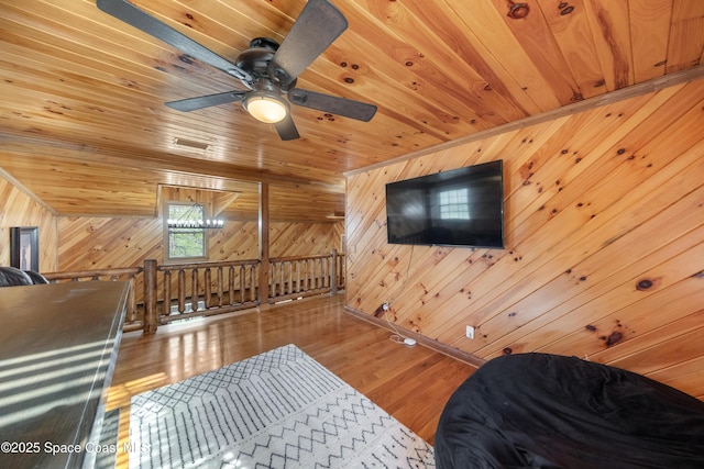 3373 Stratos Ln, Palm Bay, FL 32909 - sitting room with wooden ceiling, wooden walls, wood finished floors, an upstairs landing, and a ceiling fan
