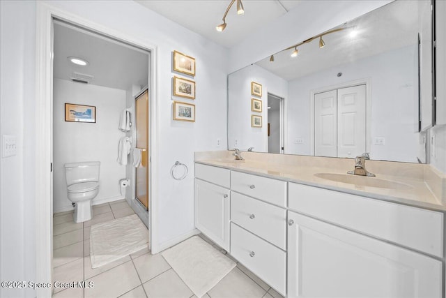 660 S Brevard Ave Unit 1535, Cocoa Beach, FL 32931 - bathroom with double vanity, tile patterned flooring, and a stall shower