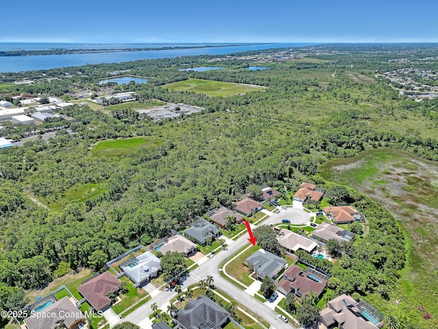 310 Chennault Ln, Rockledge, FL 32955 - aerial view of property's location with a large body of water and nearby suburban area