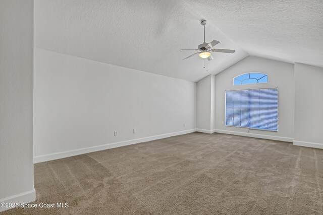 310 Chennault Ln, Rockledge, FL 32955 - carpeted spare room with lofted ceiling, a ceiling fan, and a textured ceiling
