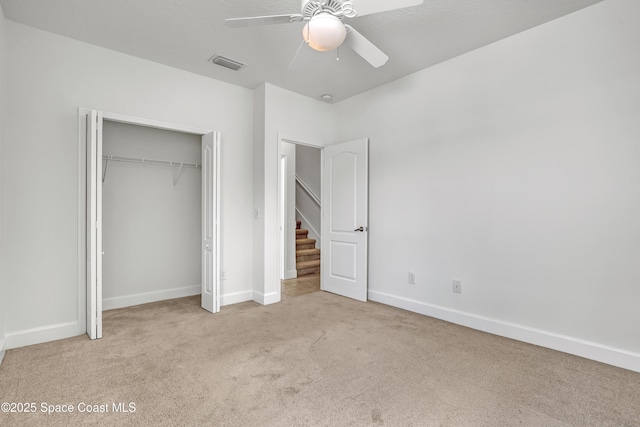 310 Chennault Ln, Rockledge, FL 32955 - unfurnished bedroom featuring carpet floors, a closet, and ceiling fan