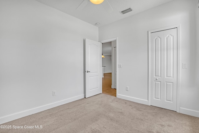 310 Chennault Ln, Rockledge, FL 32955 - unfurnished bedroom featuring carpet flooring, ceiling fan, and a closet