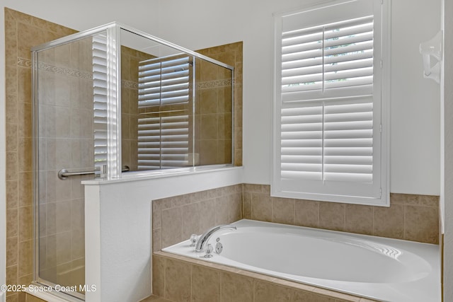 310 Chennault Ln, Rockledge, FL 32955 - full bathroom featuring a bath and a stall shower