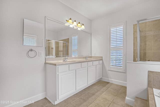 310 Chennault Ln, Rockledge, FL 32955 - full bathroom featuring double vanity, tile patterned flooring, a tile shower, and plenty of natural light