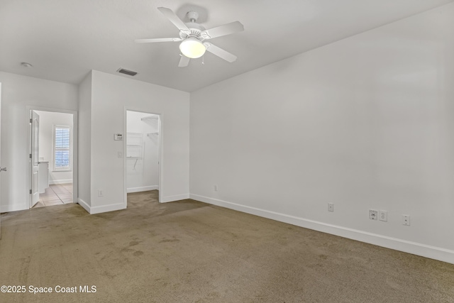 310 Chennault Ln, Rockledge, FL 32955 - unfurnished bedroom with carpet, a spacious closet, a closet, and ceiling fan