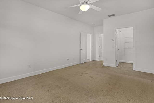 310 Chennault Ln, Rockledge, FL 32955 - unfurnished bedroom featuring carpet flooring, a spacious closet, and ceiling fan