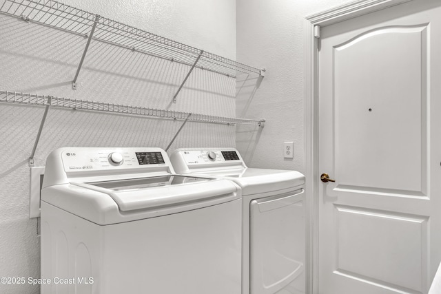 310 Chennault Ln, Rockledge, FL 32955 - washroom featuring washing machine and dryer and a textured wall